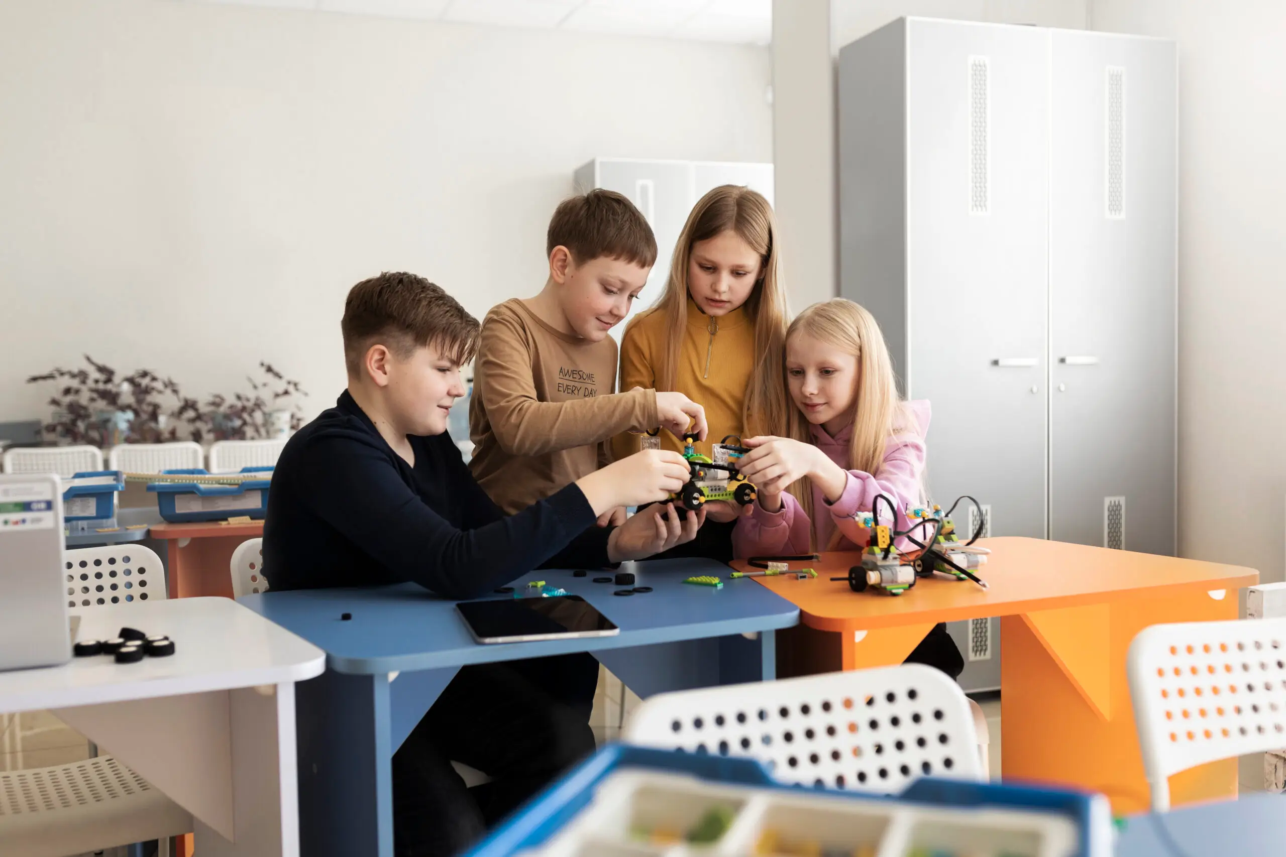 Students building a drone during a hands-on STEM activity