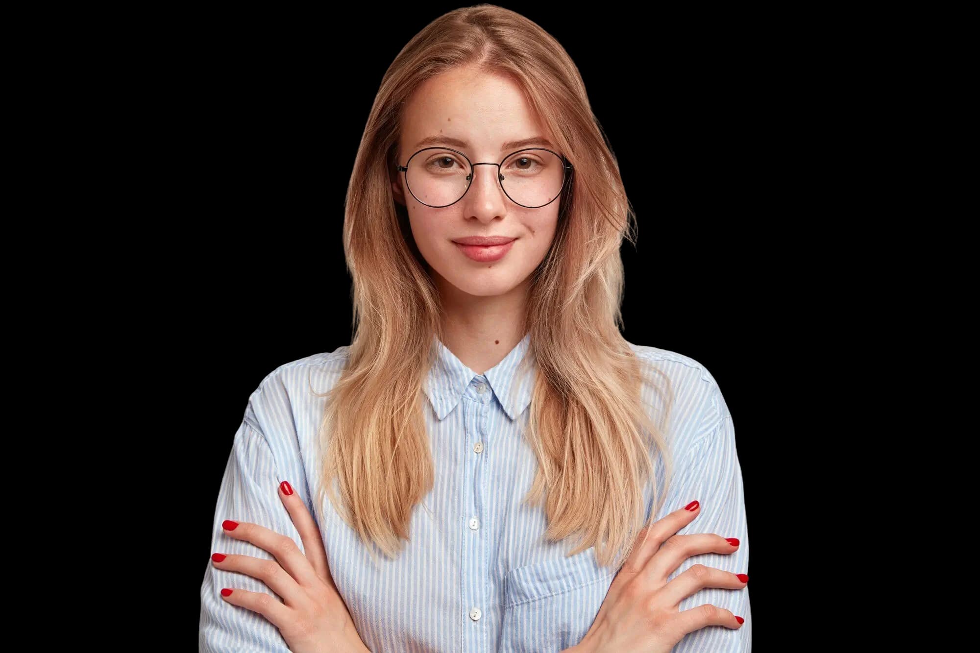 An educator smiling in a classroom